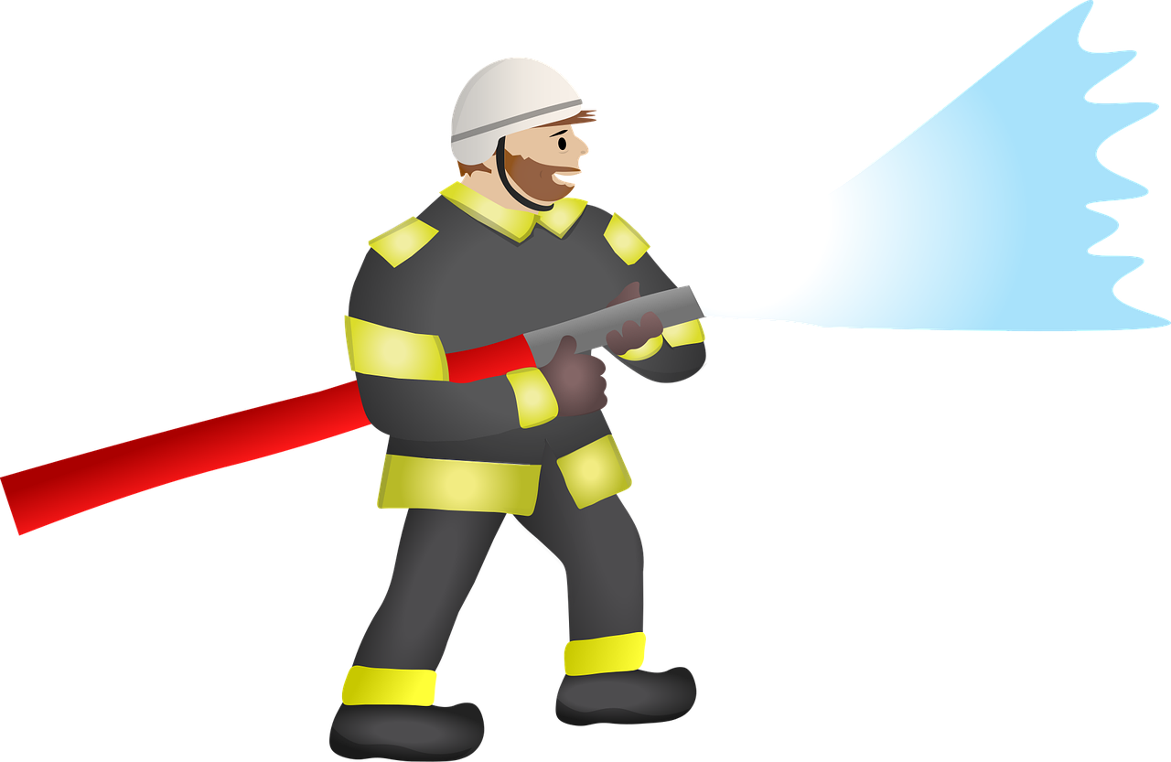 Firefighter spraying a soft wash hose